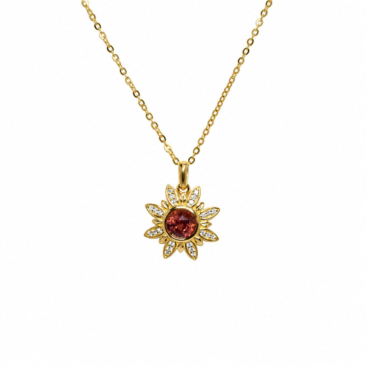 Orangy red sapphire flower pendant hanging on its 18K gold chain