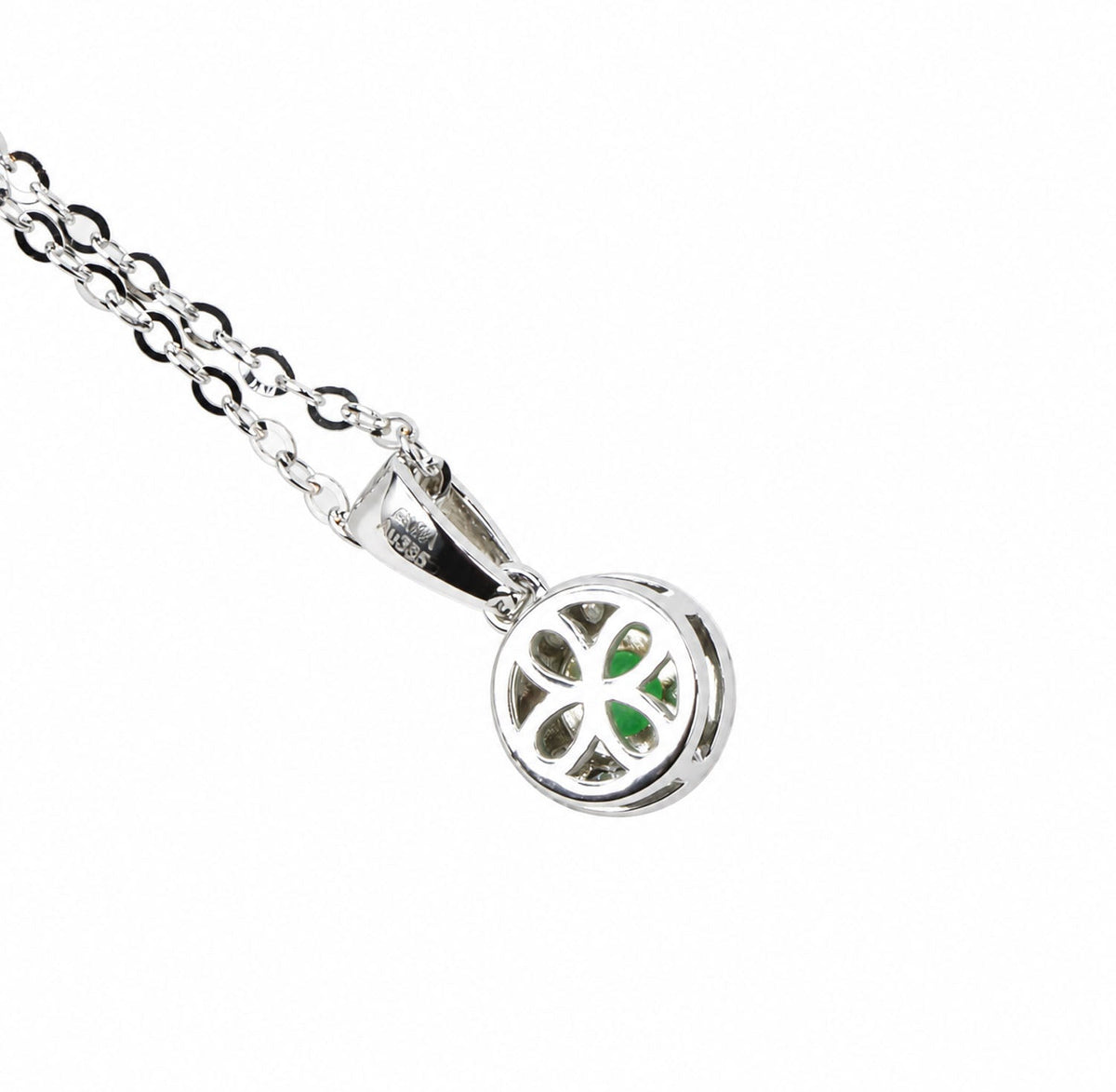 Back of the emerald pendant showing the open white gold setting