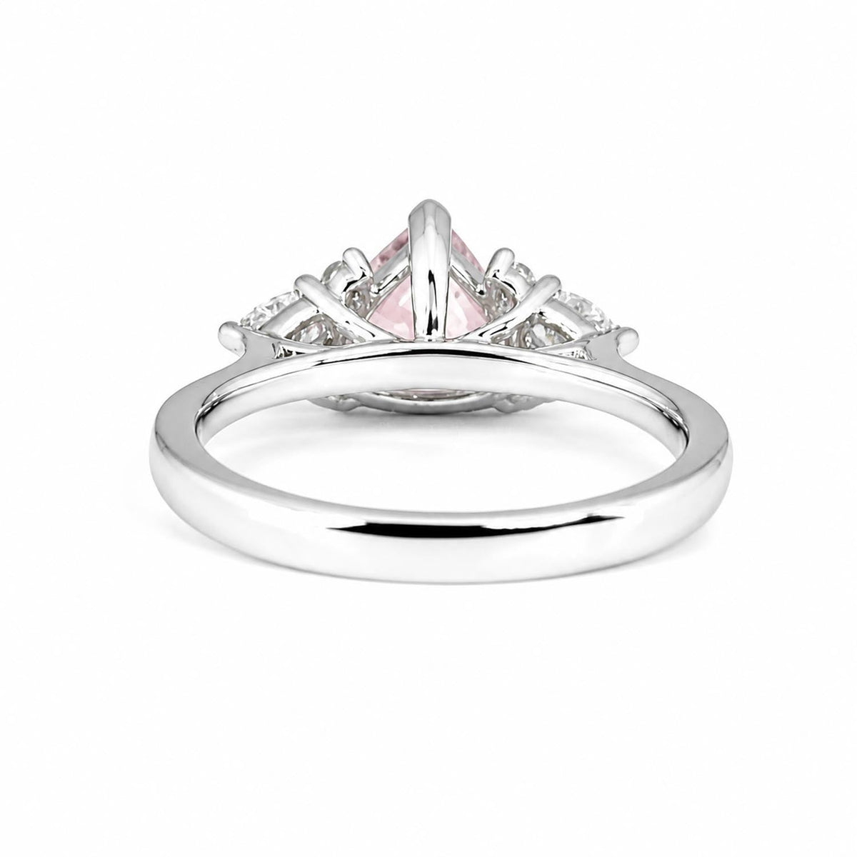 Side view of pink sapphire and diamond ring in platinum