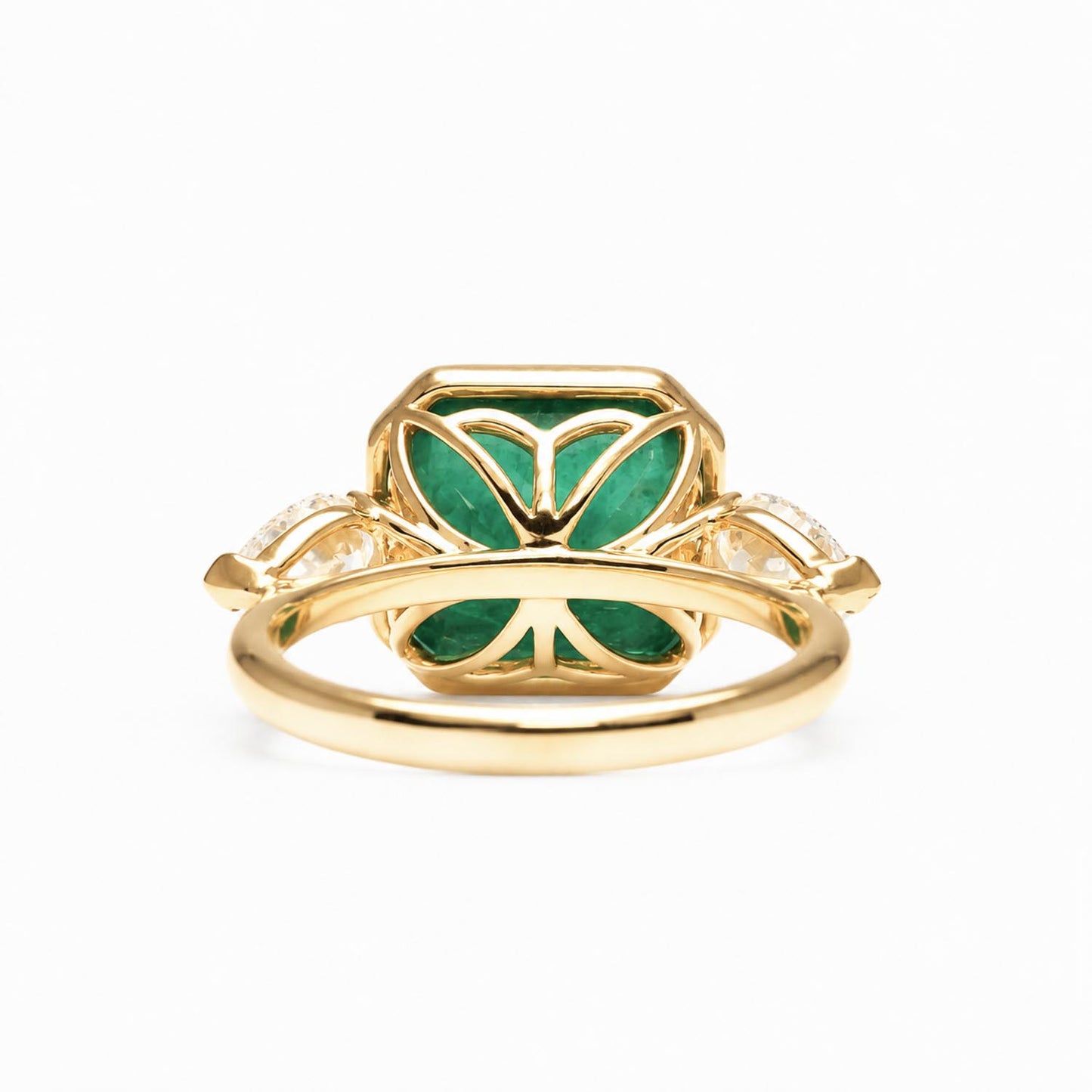 back view of Colombian Emerald and Diamond Ring in 18K Yellow Gold – East West Emerald Cut in white background