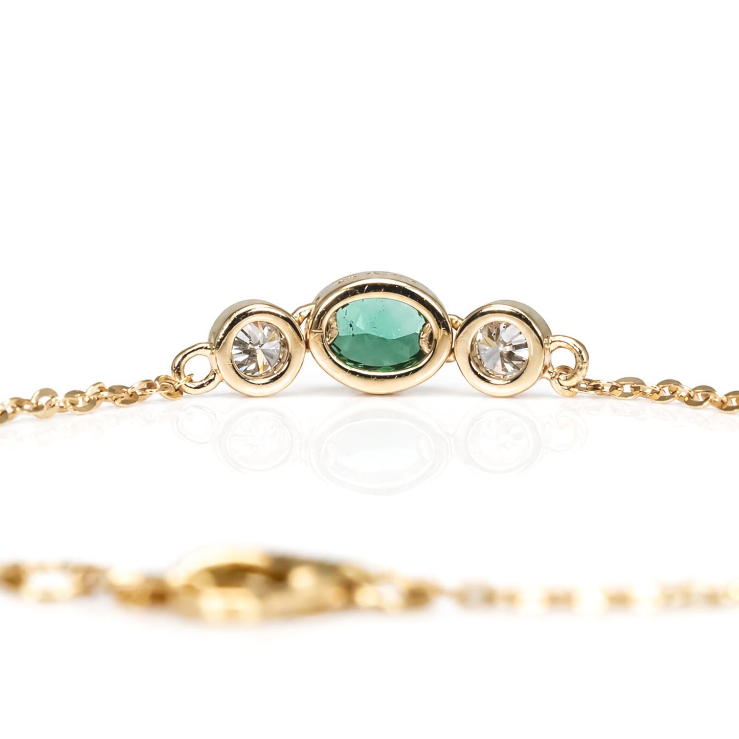 back view of a Natural Colombian Emerald & Diamond Bracelet in 18K Yellow Gold in white background