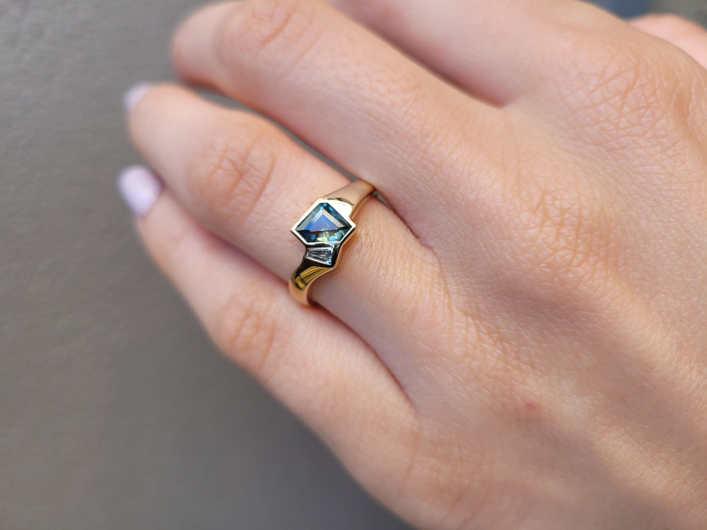 Gold ring with a green gemstone