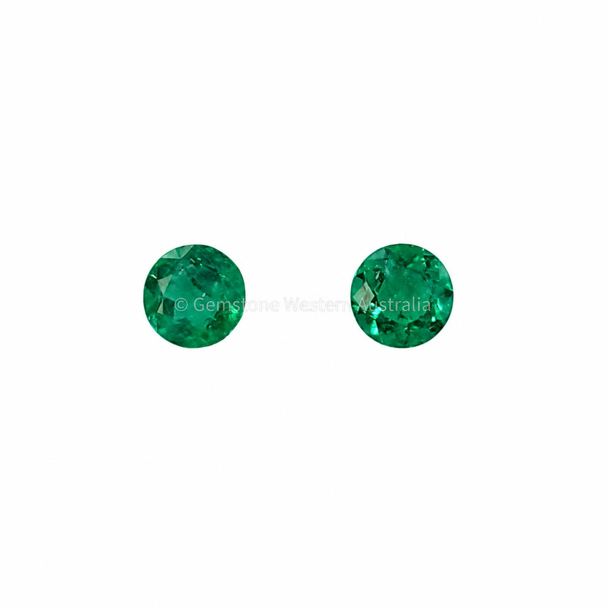 Matched pair of natural Colombian emeralds totalling 0.25 ct, round cut