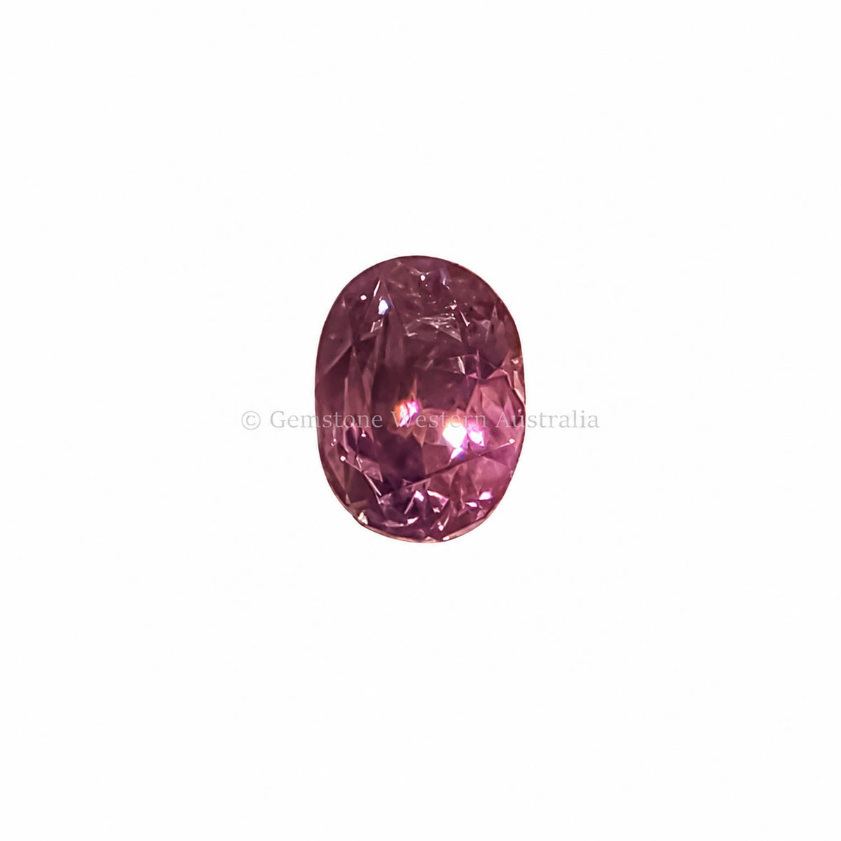 1.20 ct alexandrite under warm light showing its colour change