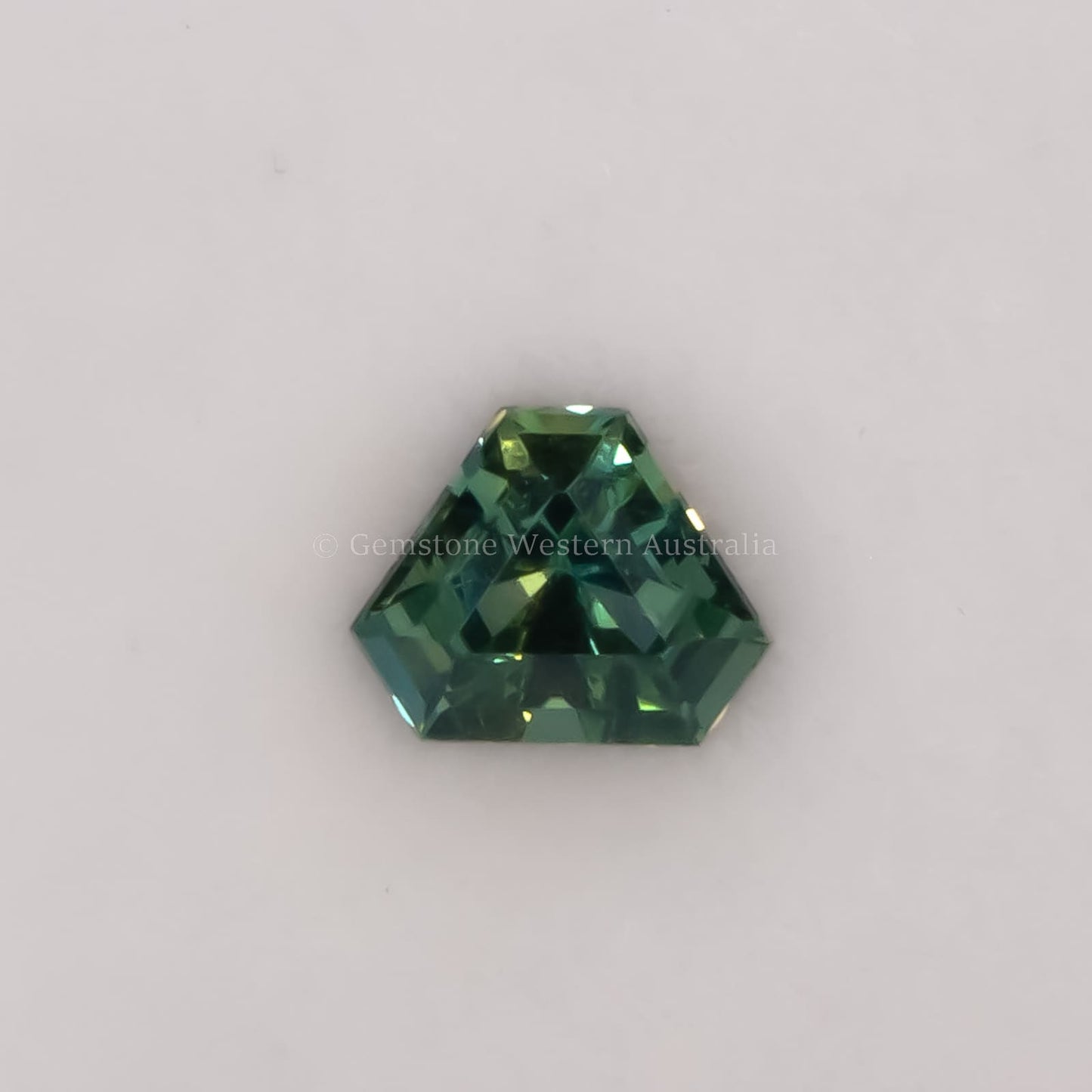 0.59 ct natural unheated teal-green sapphire - shield fancy cut