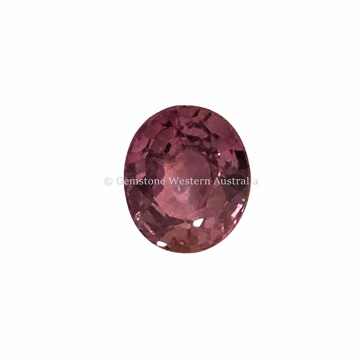 1.57 ct alexandrite under warm light showing its colour change