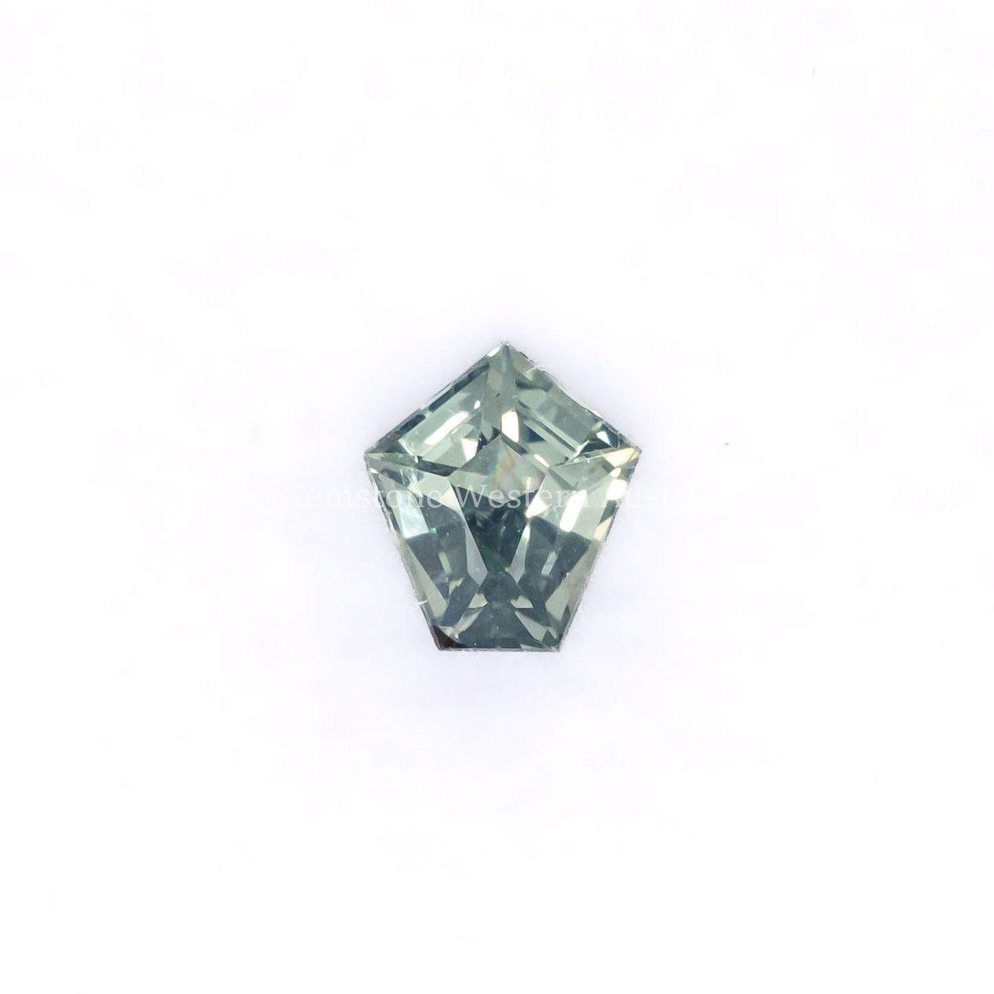 Front view of 0.61CT Natural Unheated Teal-Green Sapphire – Shield Fancy Cut in white background.
