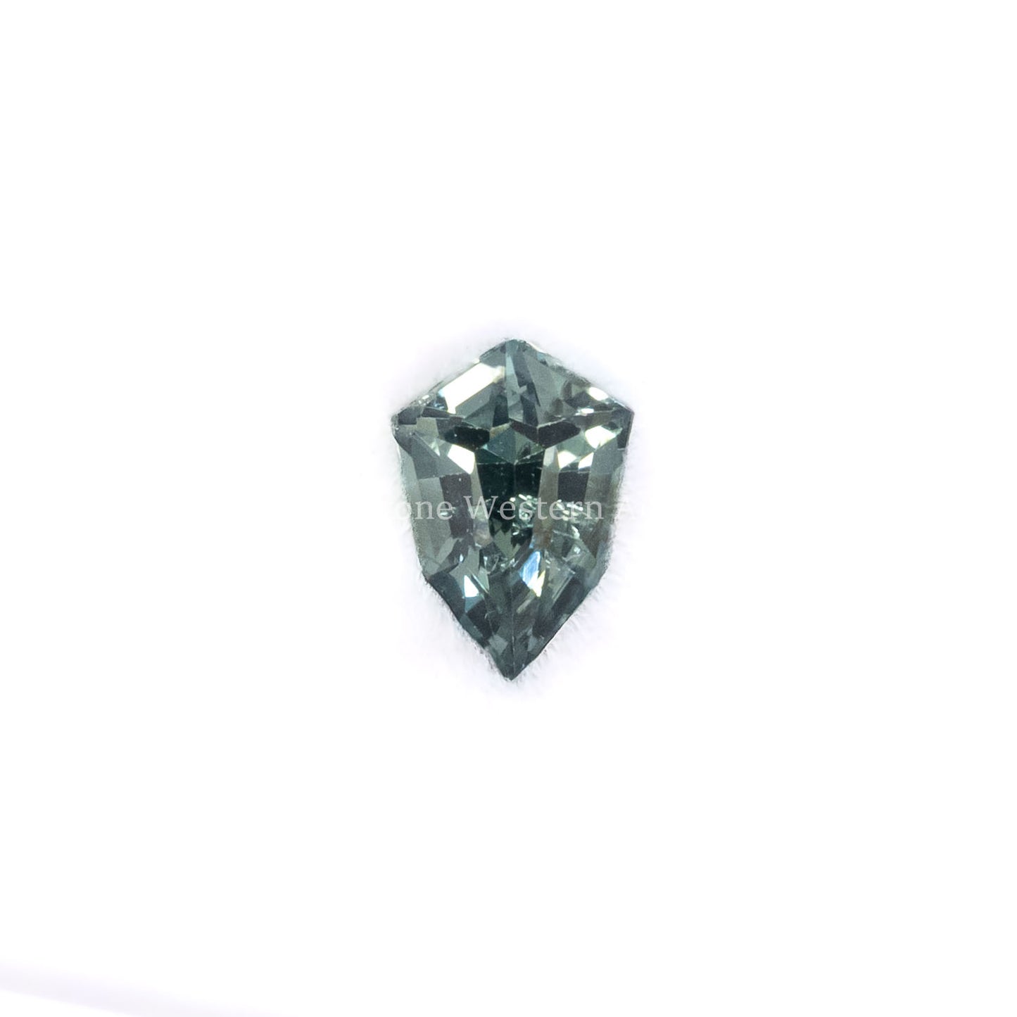 Front view of 0.51CT Natural Unheated Teal-Green Sapphire – Shield Fancy Cut in a white background