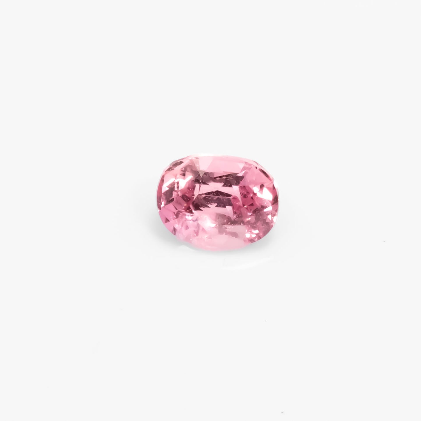 Front view of 0.63CT Natural Unheated Pink Sapphire – Oval Mixed Cut in white background.