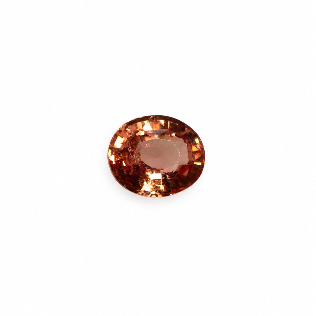 1.05 ct padparadscha sapphire oval cut shown at an angle