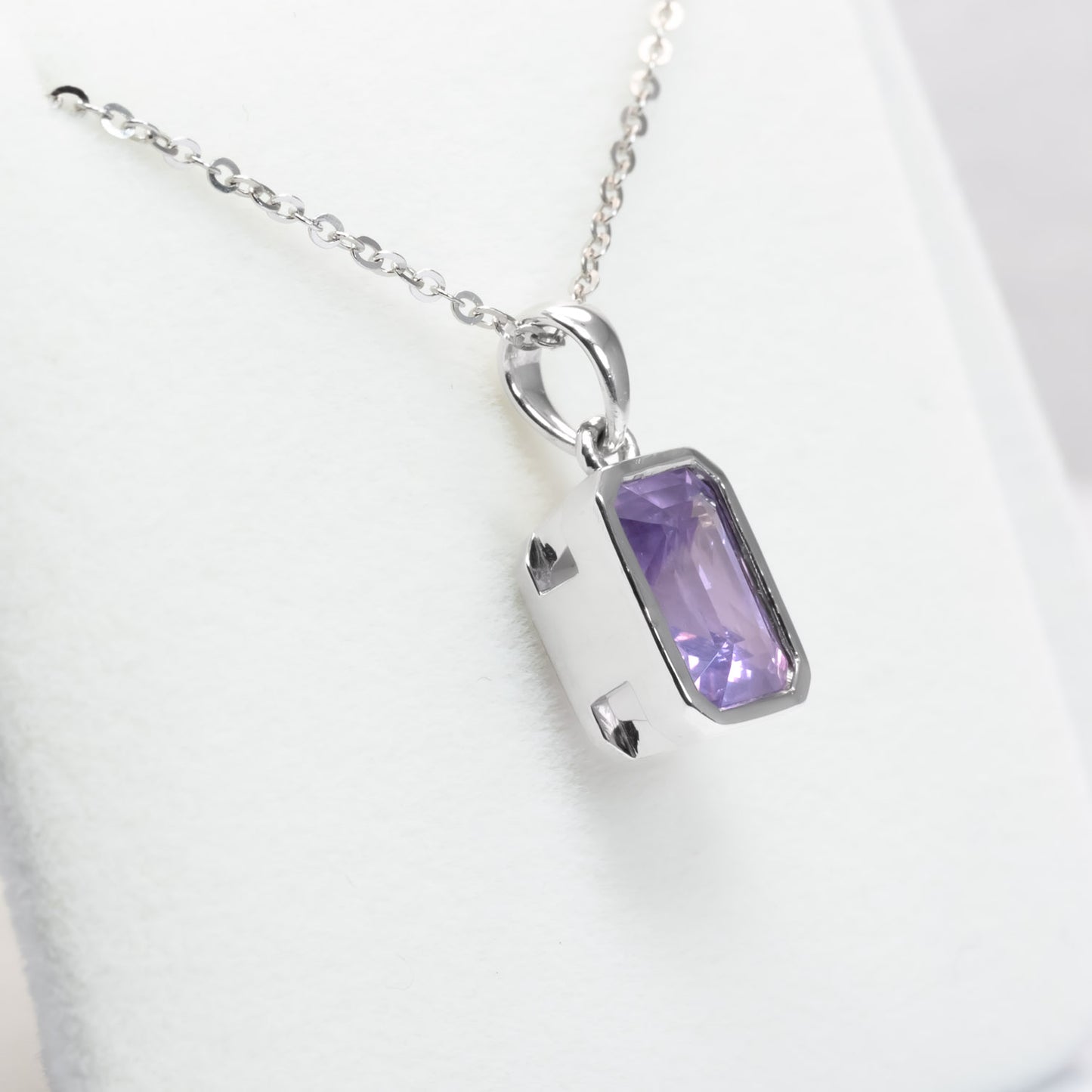 side view of 3.10ct unheated Violet Sapphire Pendant in 950 Platinum in white background