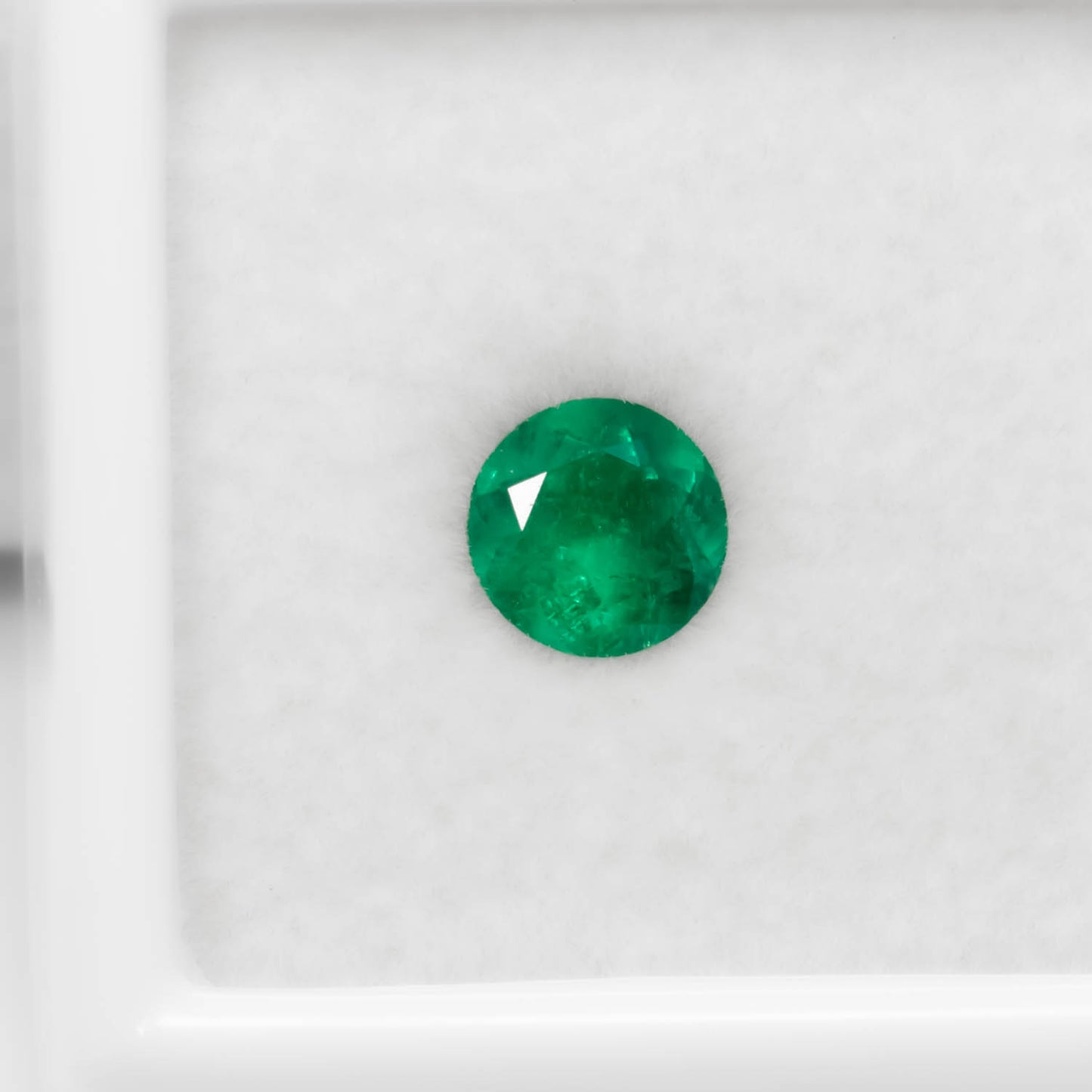 front view of 0.72CT Natural Colombian Emerald – Round Cut Strong Green Gemstone