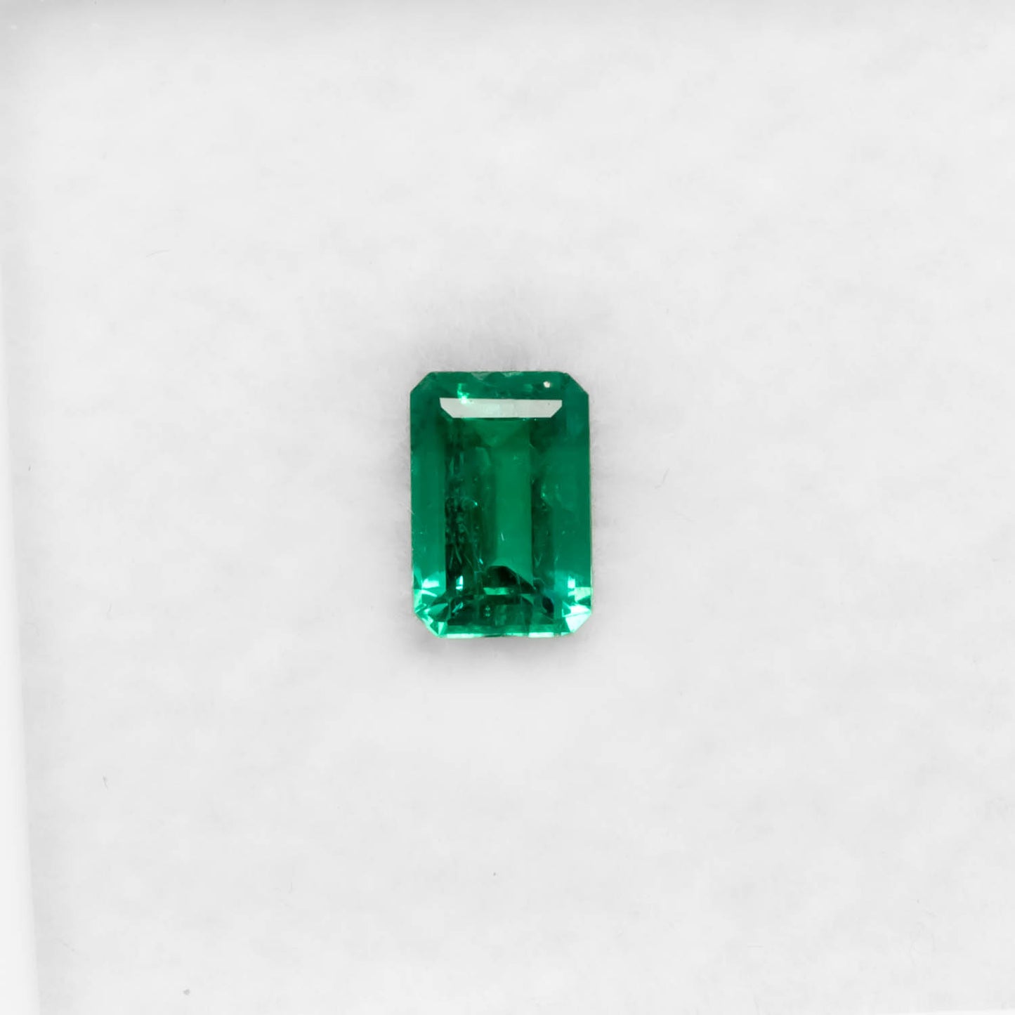 front view of 0.45CT Natural Colombian Emerald – Emerald Cut Fine Green Gemstone