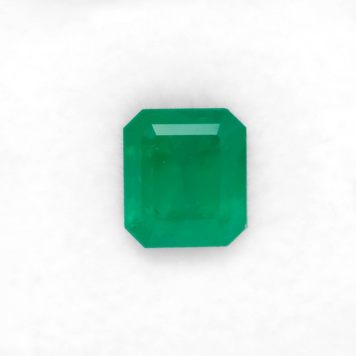 Front view of 2.74CT Natural Colombian Emerald – Emerald Cut Deep Green Gemstone in white background.