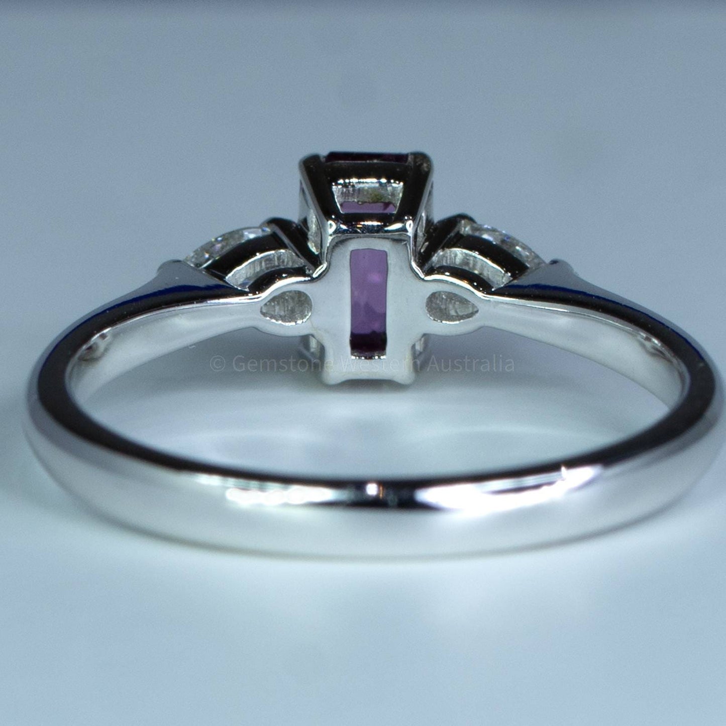 Silver ring with a purple gemstone