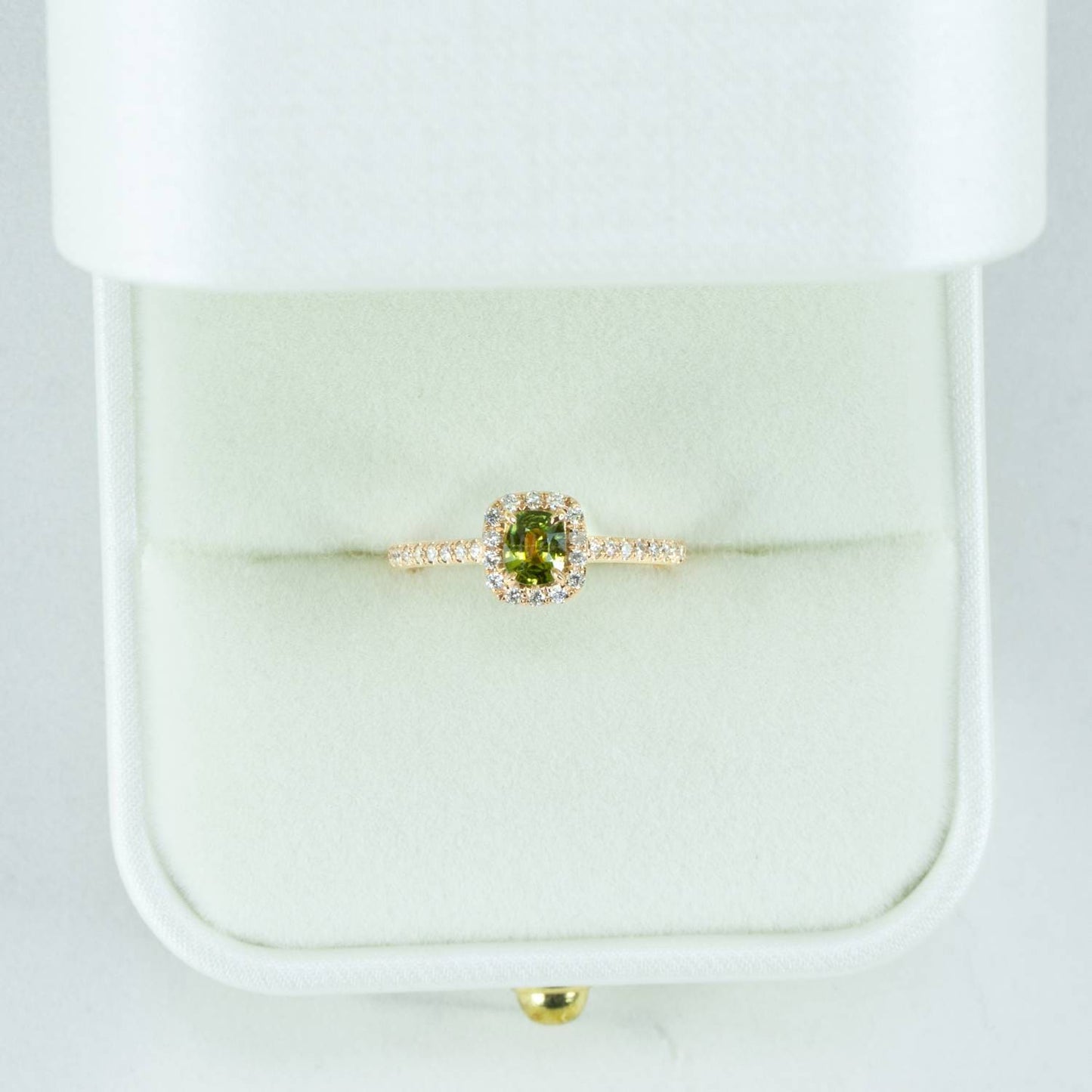 Cushion cut alexandrite ring with diamond halo