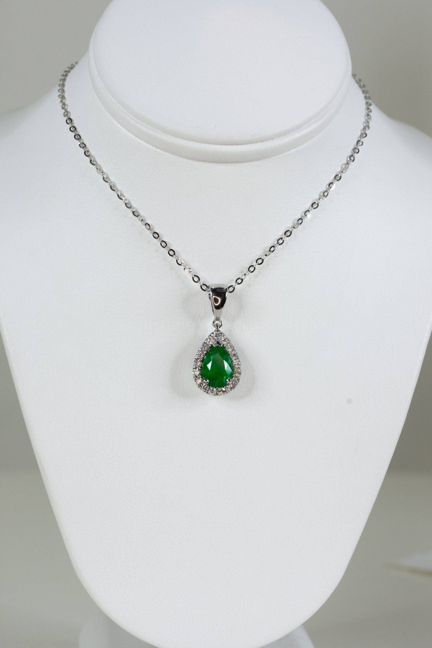 Pear Shape Colombian emerald halo pendant
