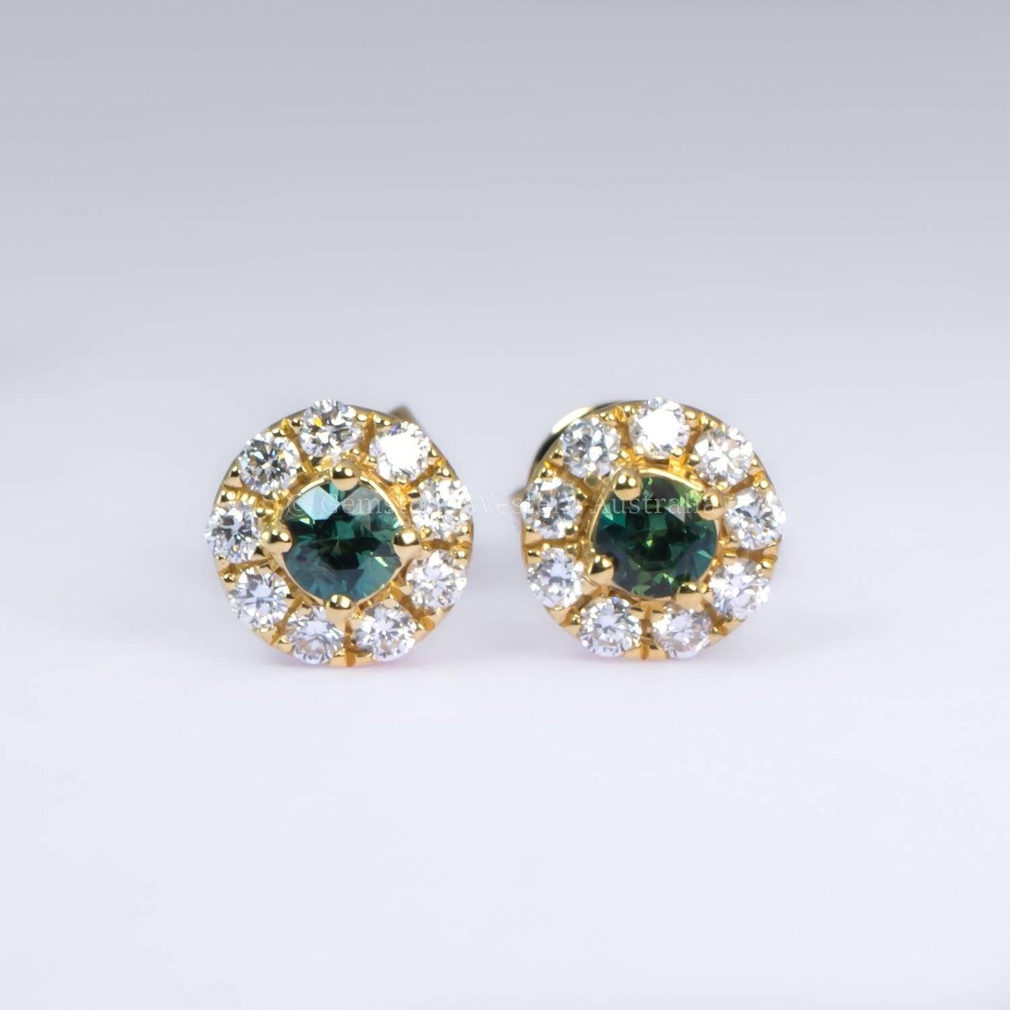 Australian Teal Sapphire Stud Earrings with Diamond Halo in 18K Yellow Gold