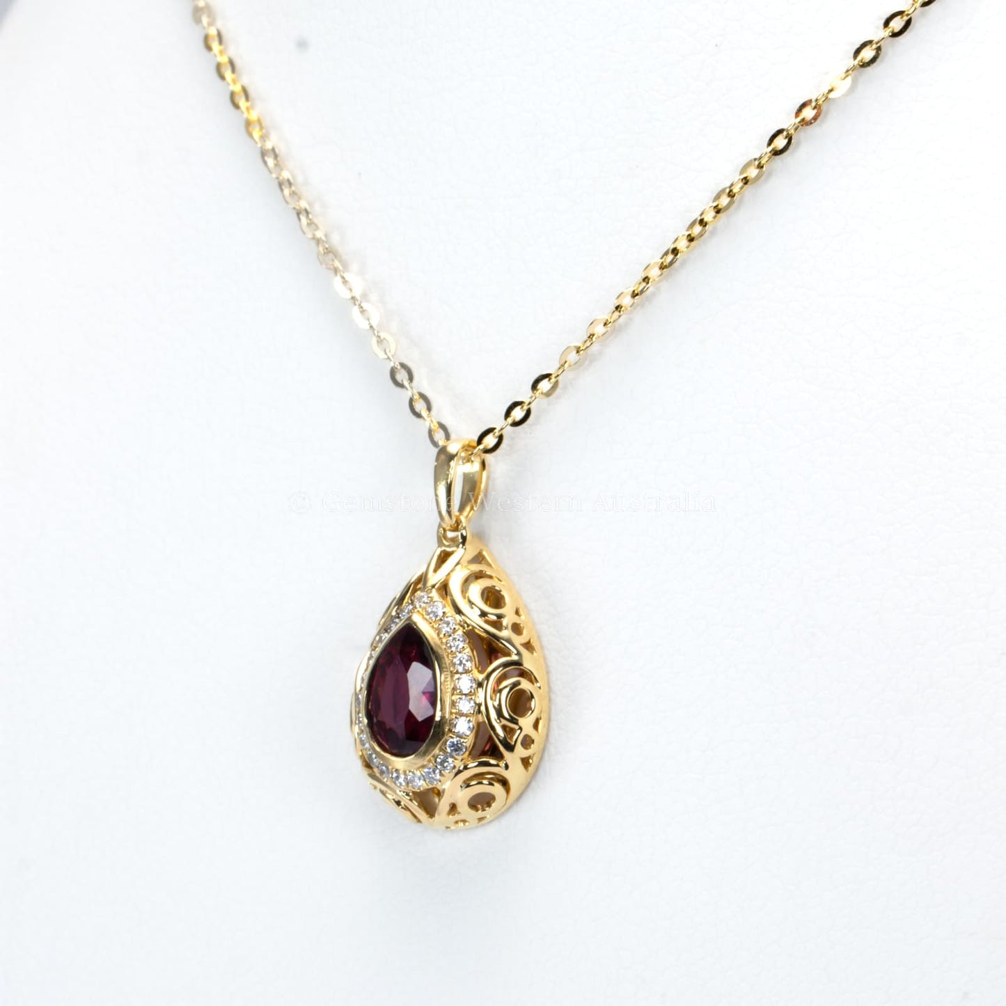 Pear Shape Unheated Ruby Pendant with Diamond Halo in Elegant Drop Design