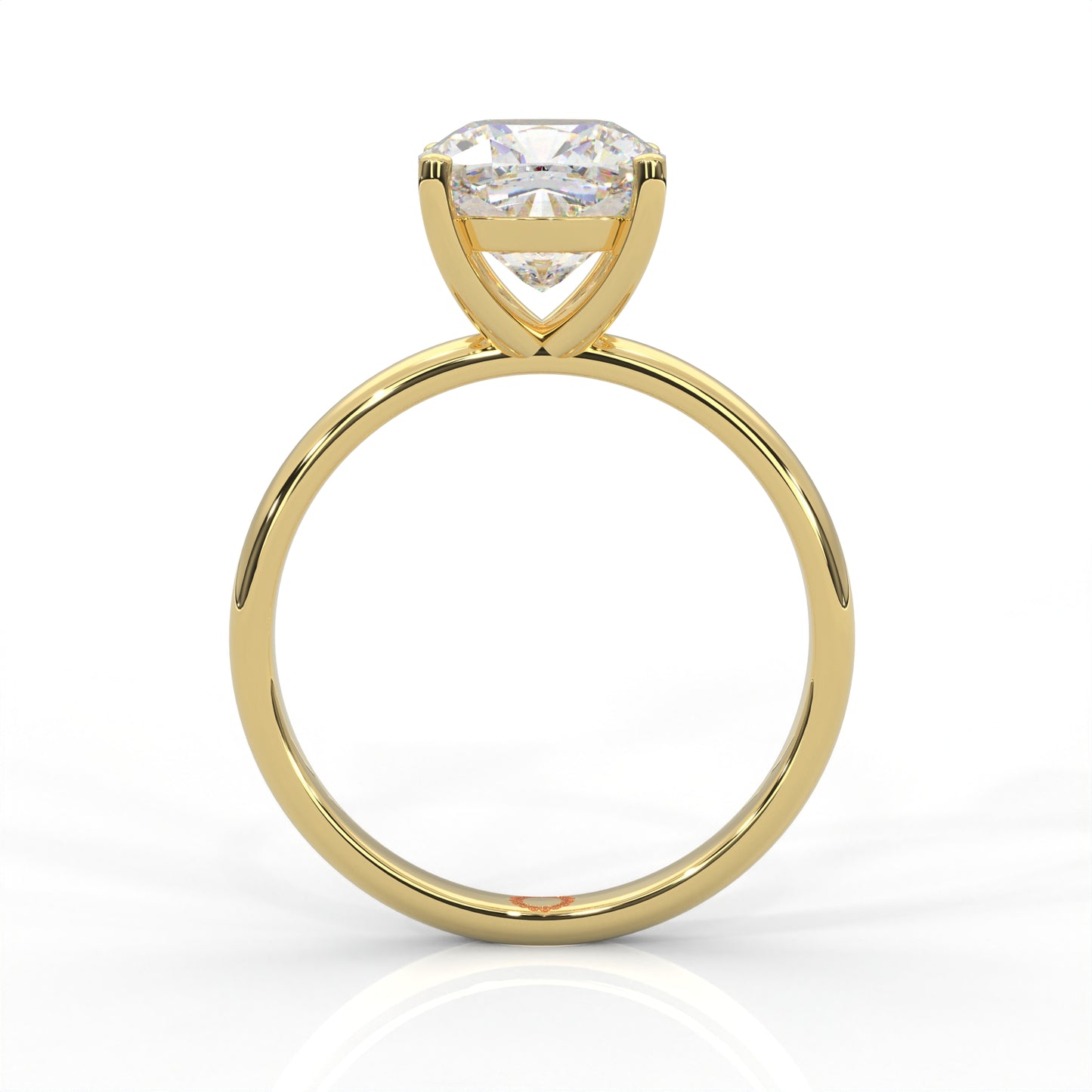 front view of Yellow gold solitaire ring with round diamond on a white background