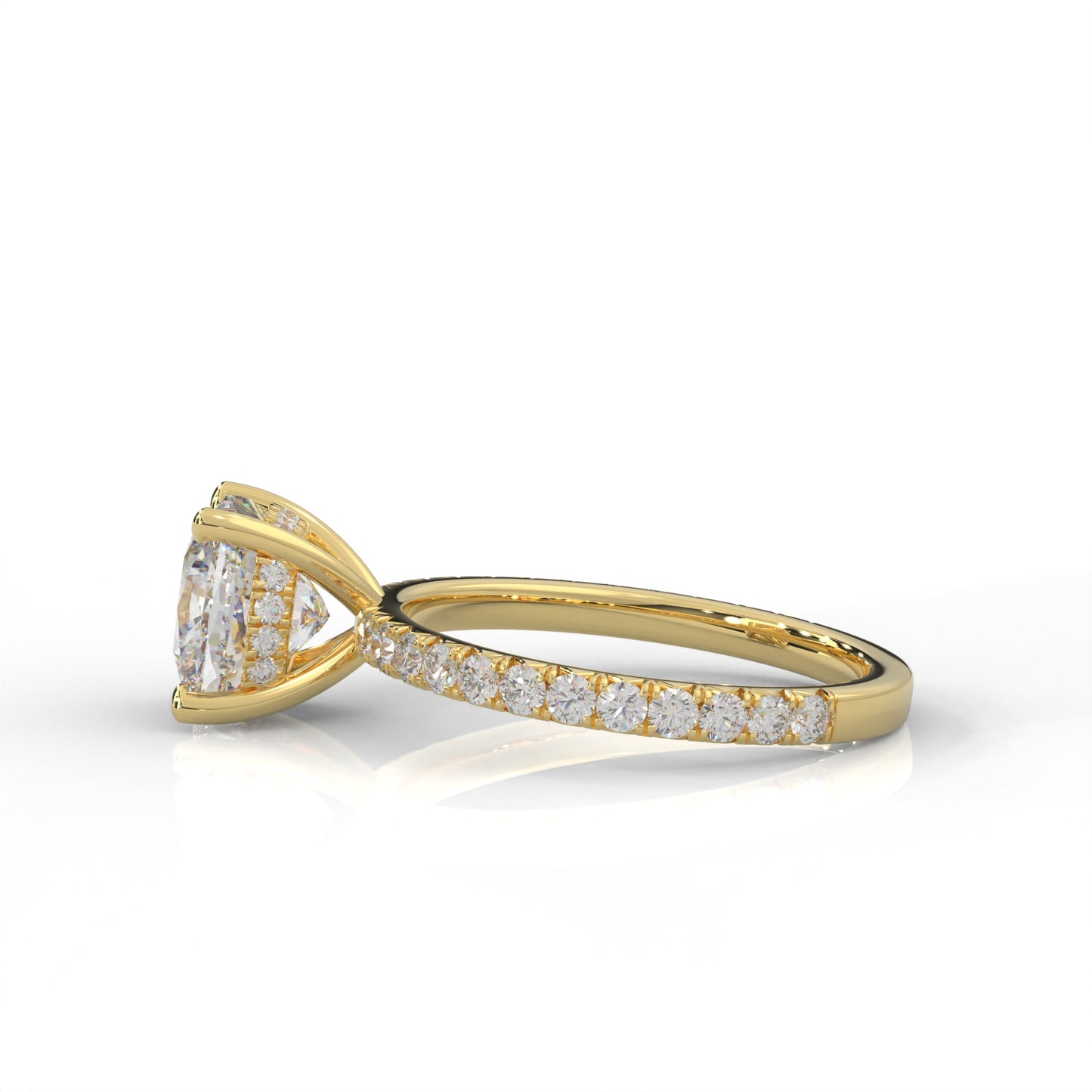 side view of yellow gold ring with a cushion cut diamond and smaller diamonds on the band against a white background