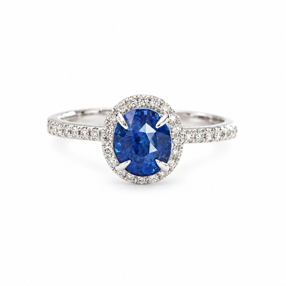 1.85 ct oval Ceylon sapphire with a full diamond halo in white gold