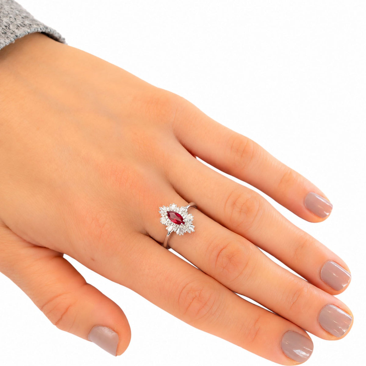 Unheated ruby and diamond ring worn, hand resting