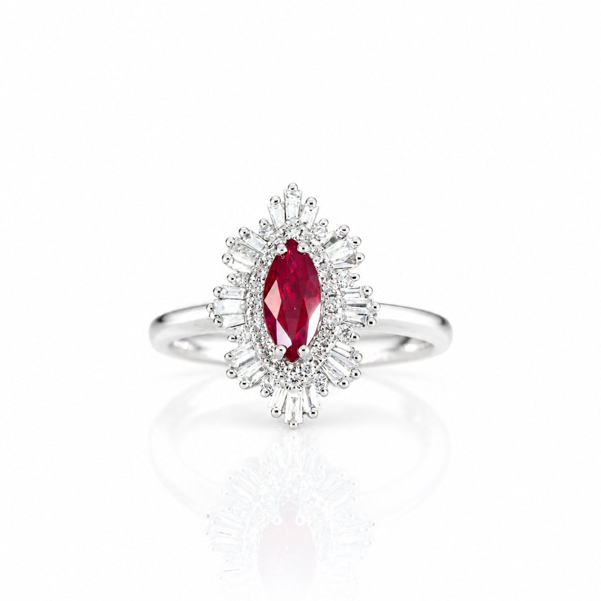 Marquise ruby ring with tapered baguette diamond halo on a white gold band