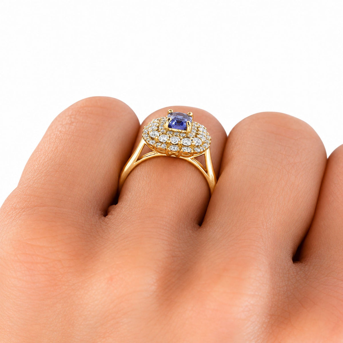 Sapphire double halo ring on the finger, close view
