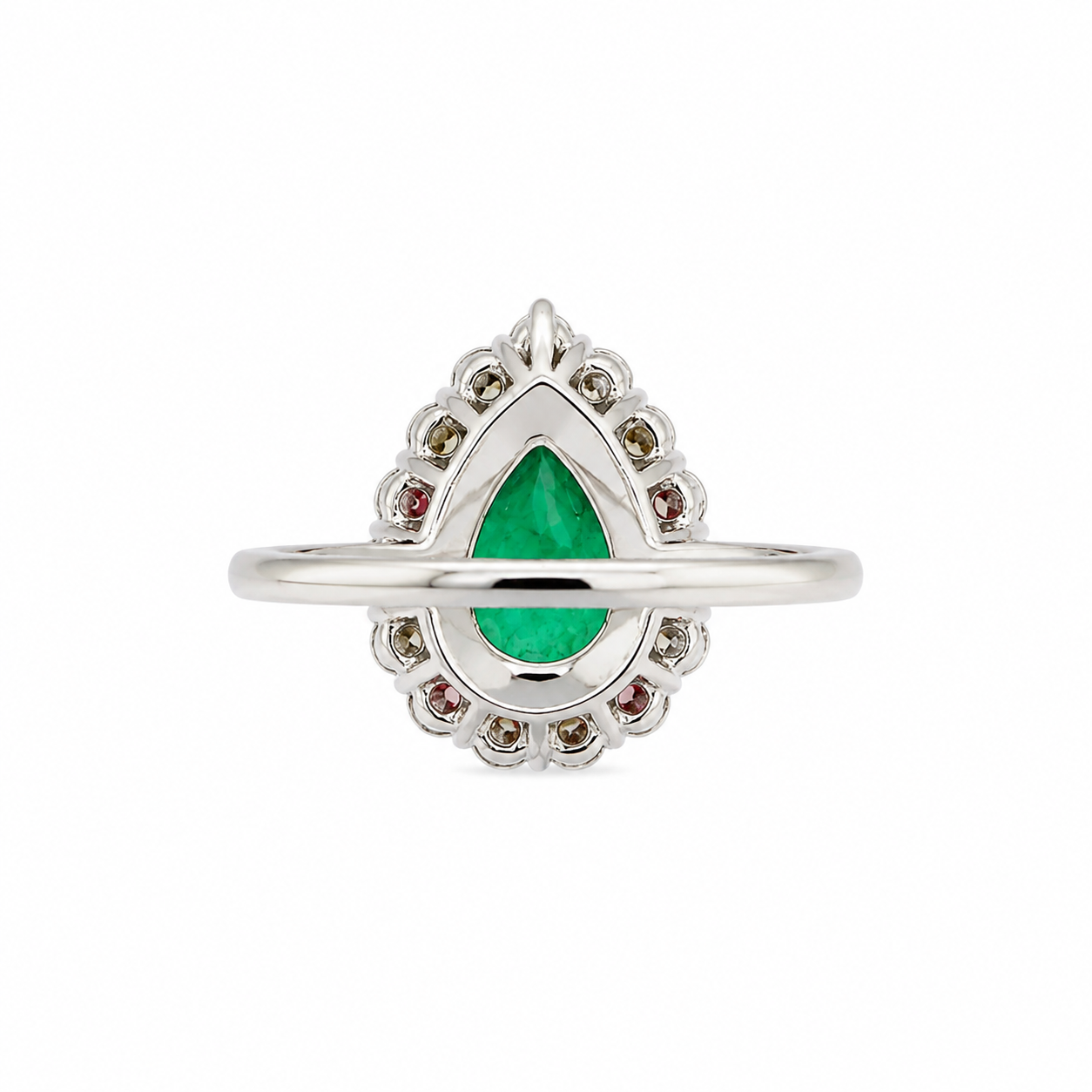 back view of a white gold ring featuring a central teardrop-shaped Colombian emerald gemstone surrounded by small diamonds, set against a plain white background.