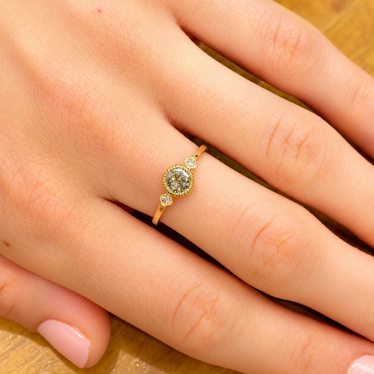 Salt and pepper diamond ring worn on the hand