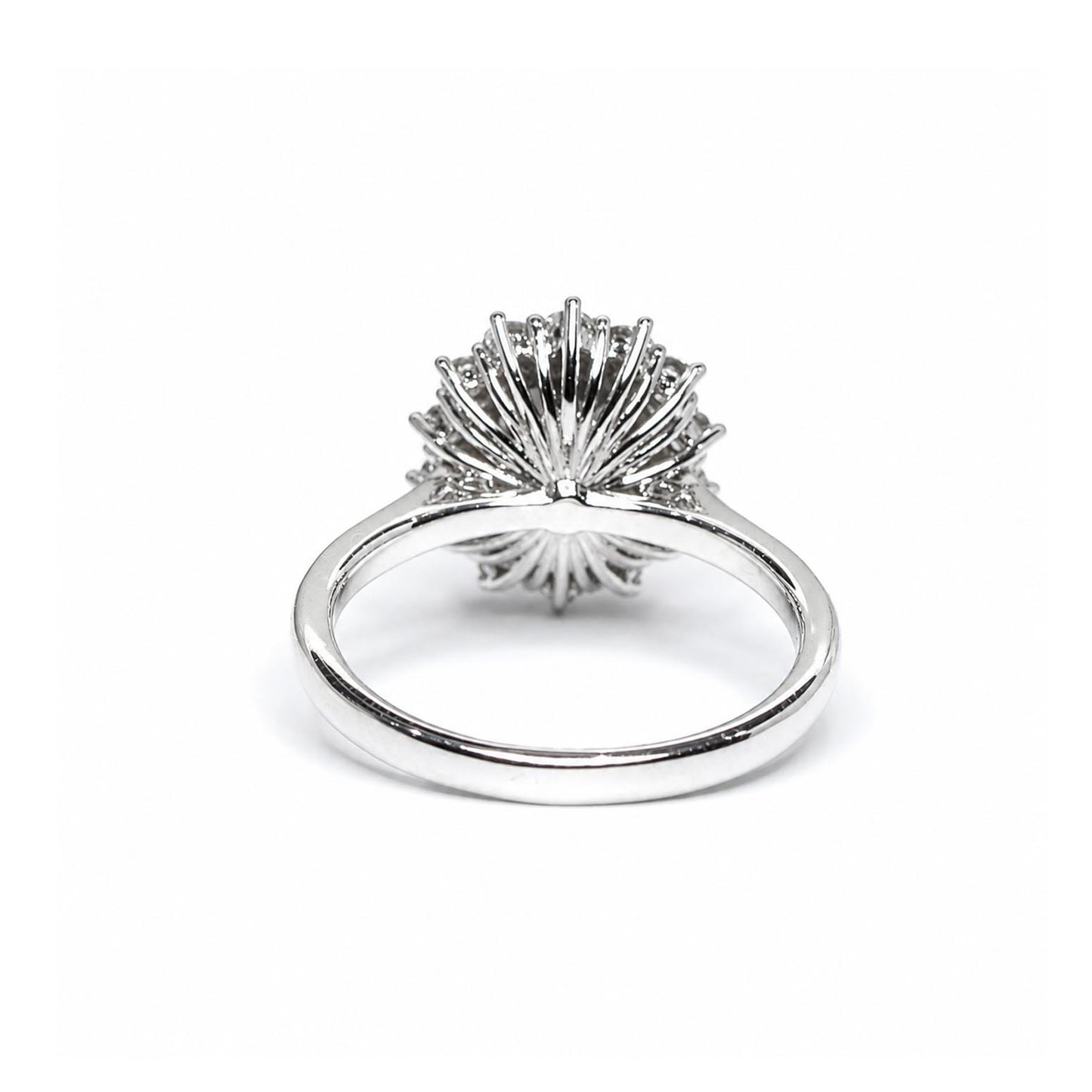 Back view of a platinum ring featuring a highly textured, fan-like or sunburst crown setting, shown on a clean white background.