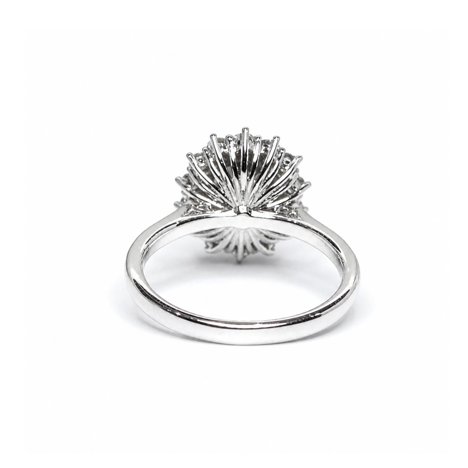Back view of a platinum ring featuring a highly textured, fan-like or sunburst crown setting, shown on a clean white background.