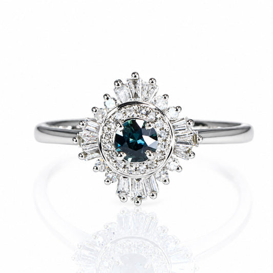 Teal sapphire ring with a baguette and round diamond halo in white gold