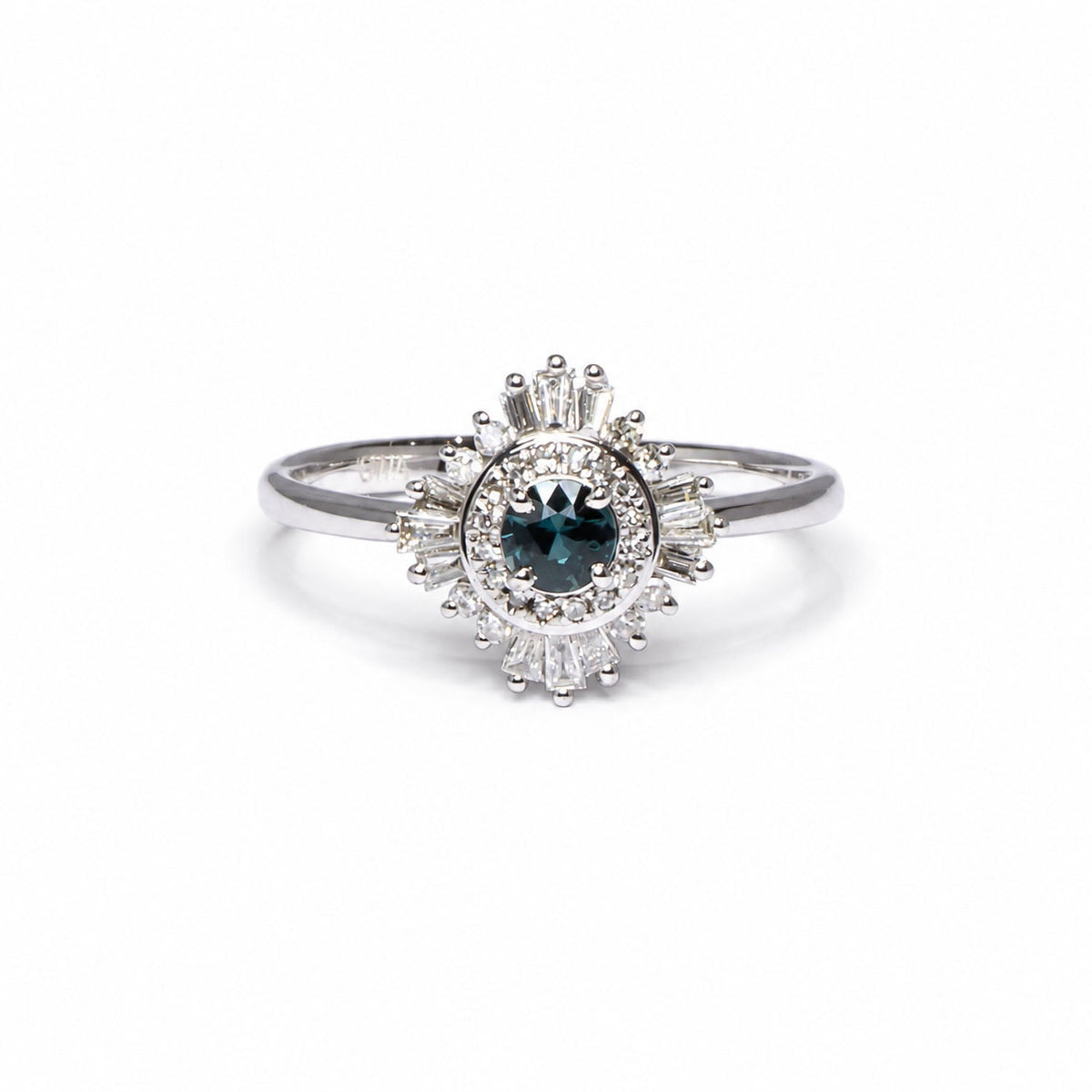 Round teal sapphire framed by baguette diamonds in white gold