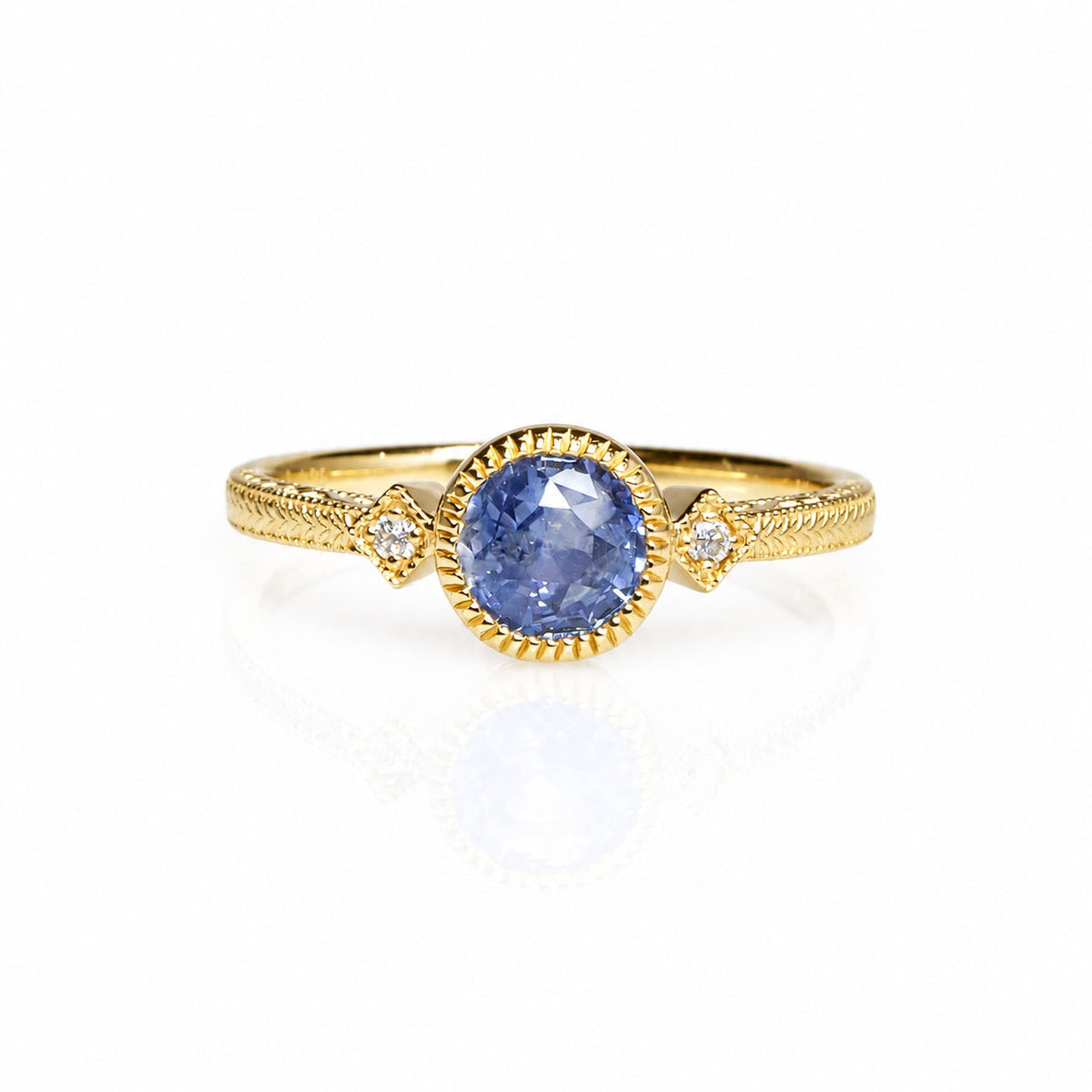 1 carat unheated blue sapphire ring with two diamonds in 14K gold