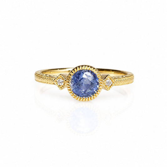 1 carat unheated blue sapphire ring with two diamonds in 14K gold