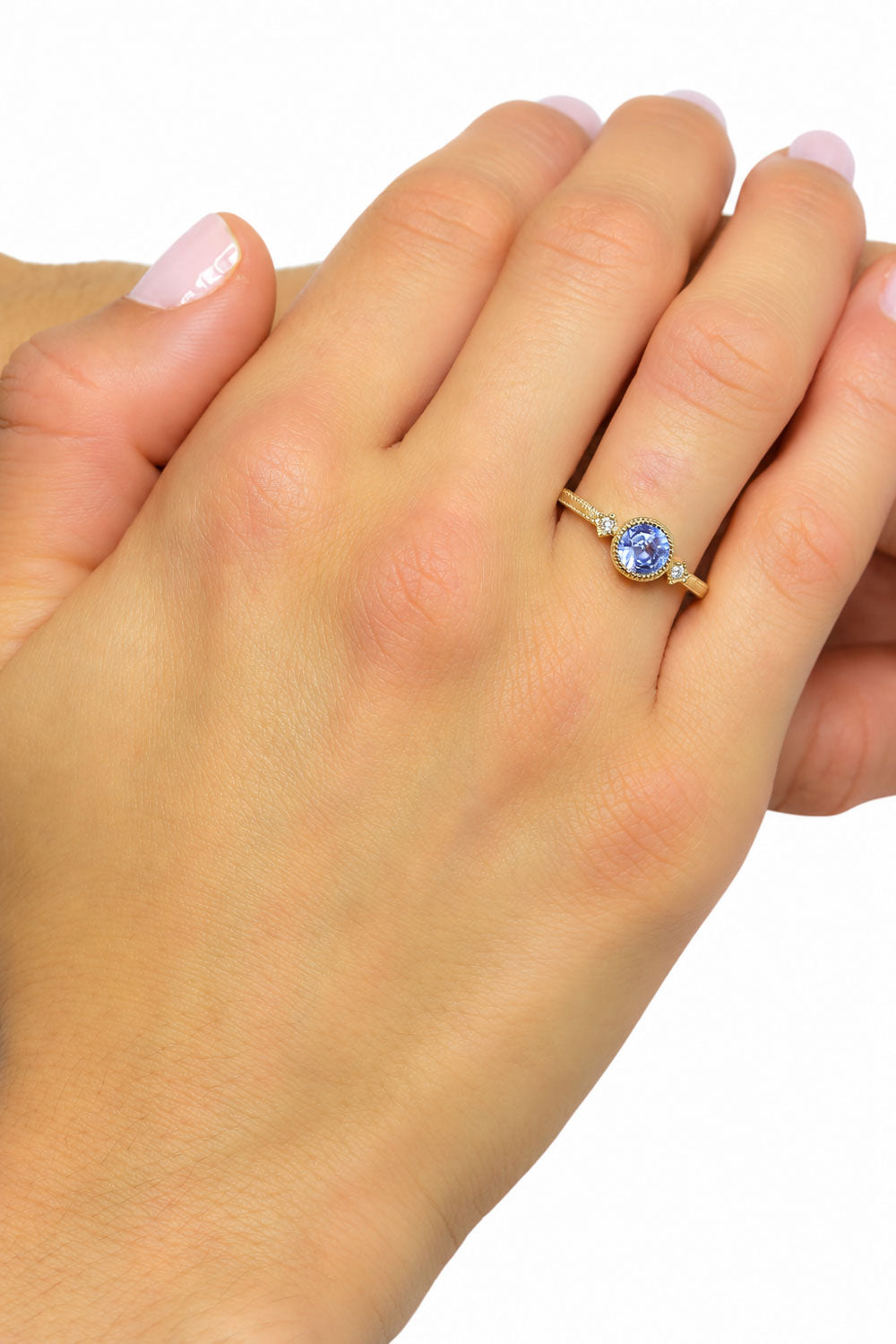 Unheated sapphire and diamond ring worn on the hand
