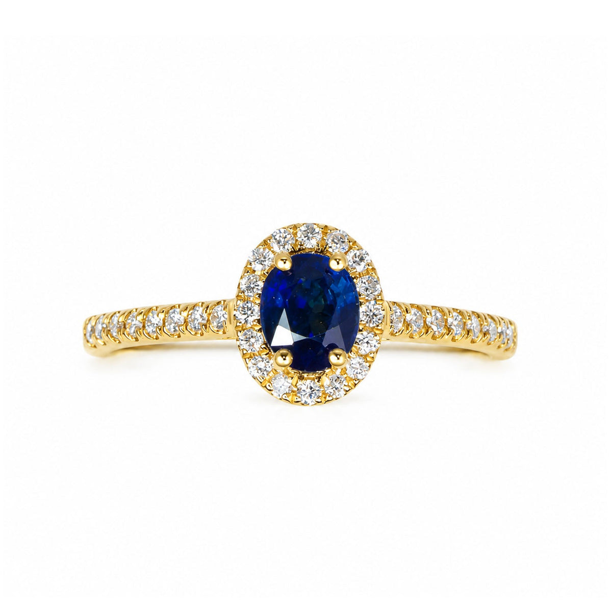 Oval blue sapphire with a diamond halo and pave-set shoulders