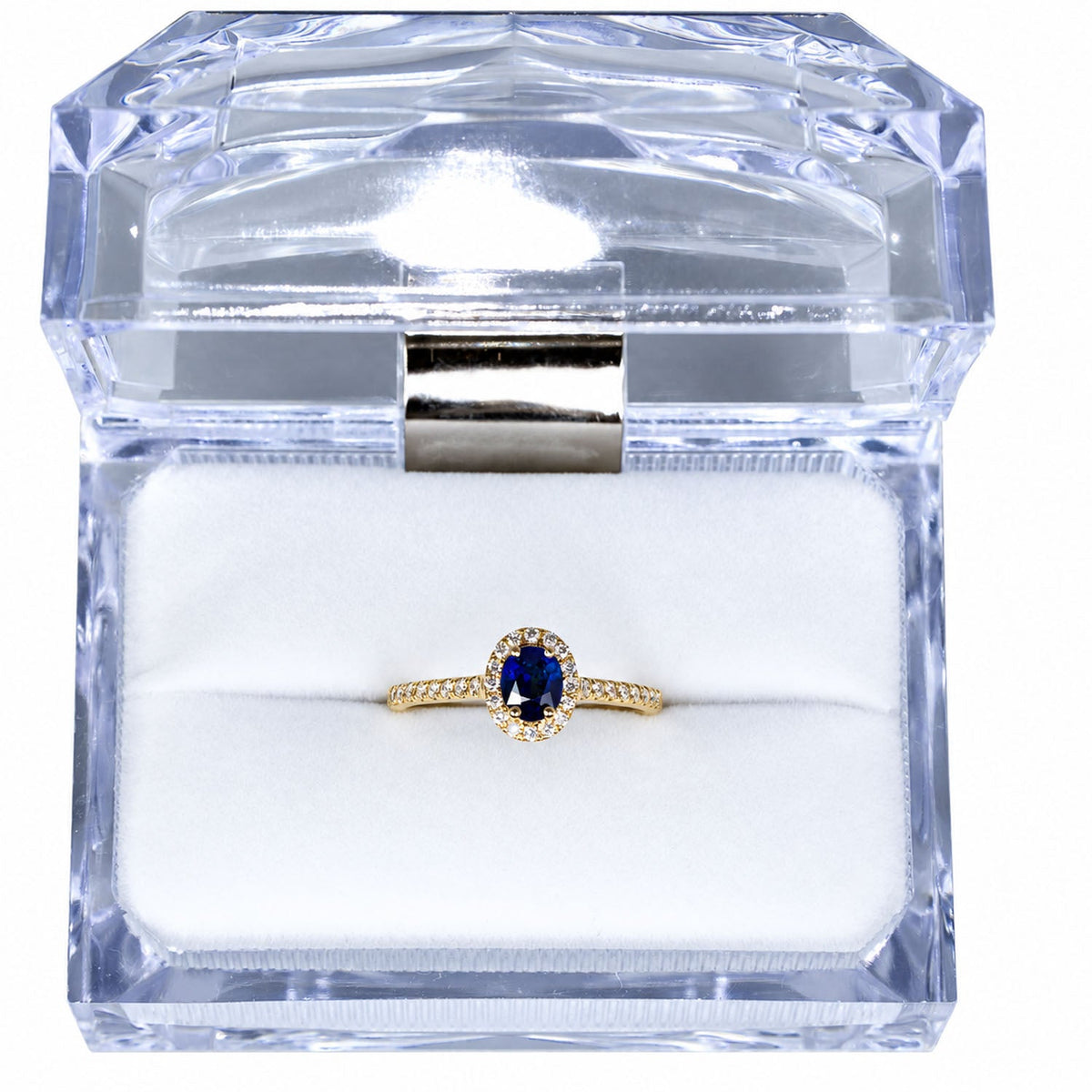 Blue sapphire halo ring presented in its crystal gift box