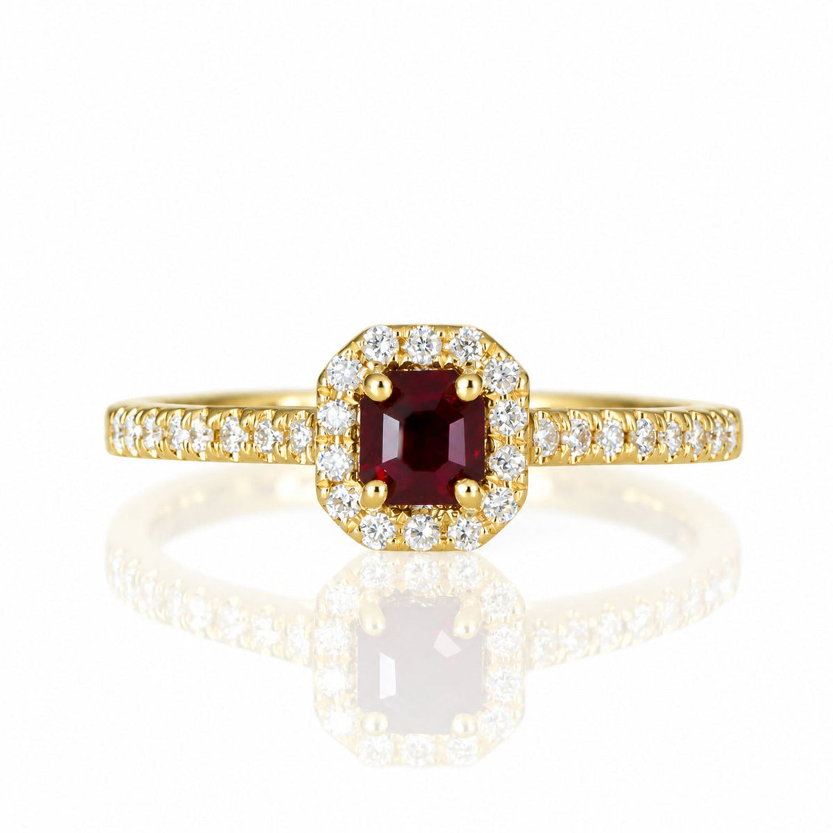 Natural ruby and diamond halo ring in 18K yellow gold