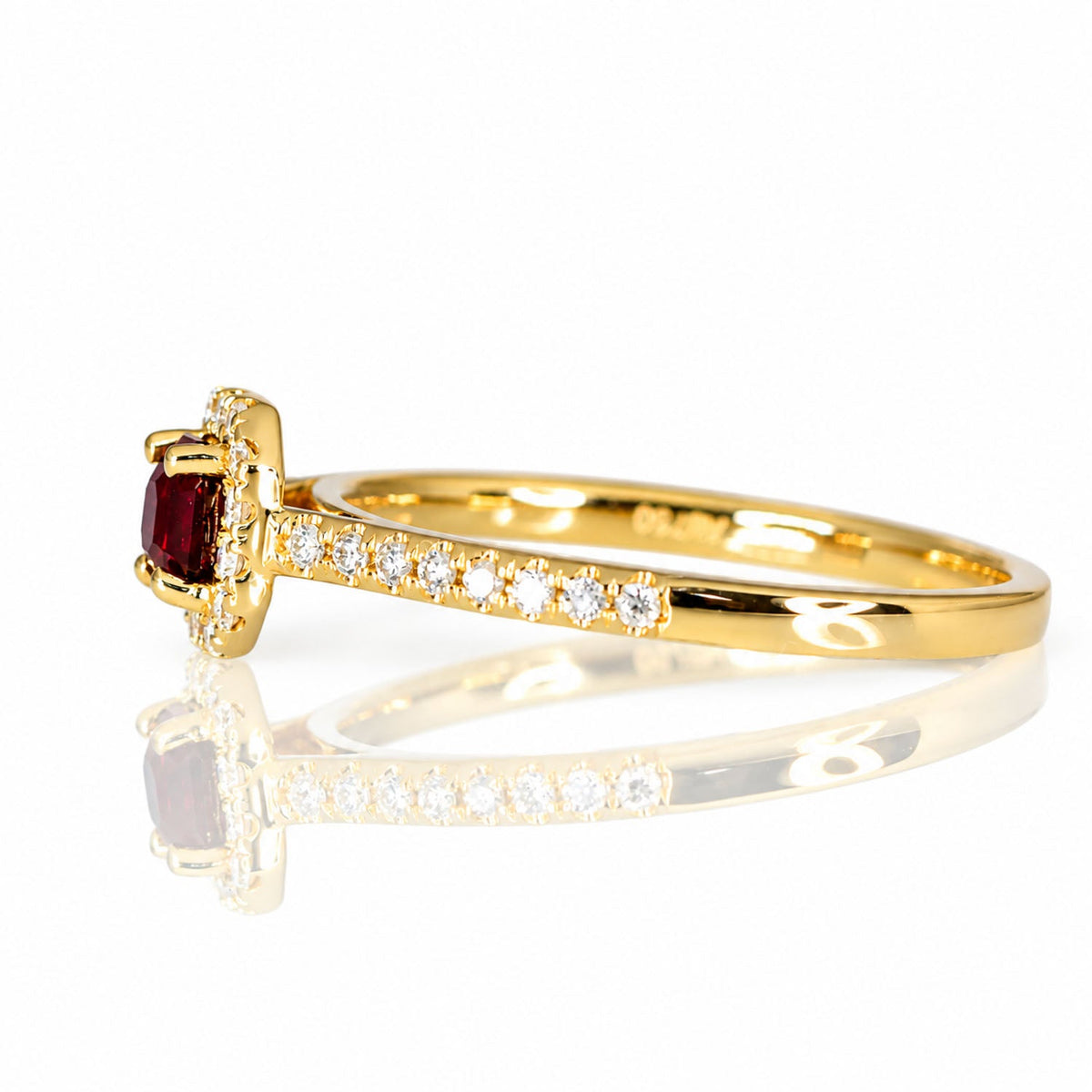 Side profile of the ruby ring showing its pave-set band