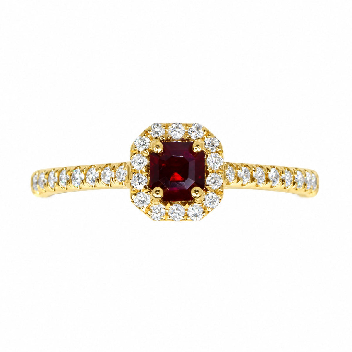 Cushion-cut ruby framed by a square diamond halo in yellow gold