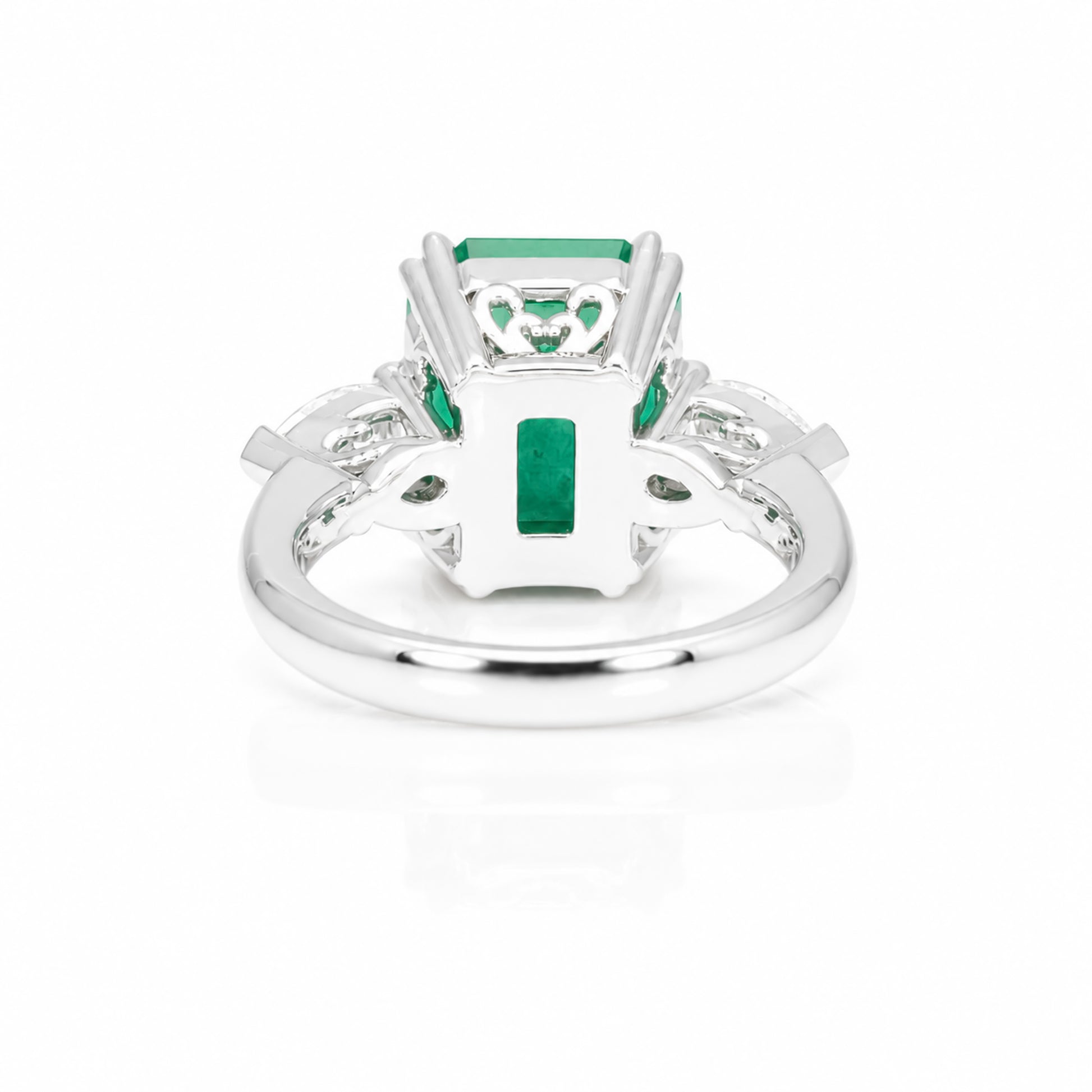 back view of a 6.46 Carats Colombian Emerald and Diamond Statement Ring with GIA Certified diamonds in a white background