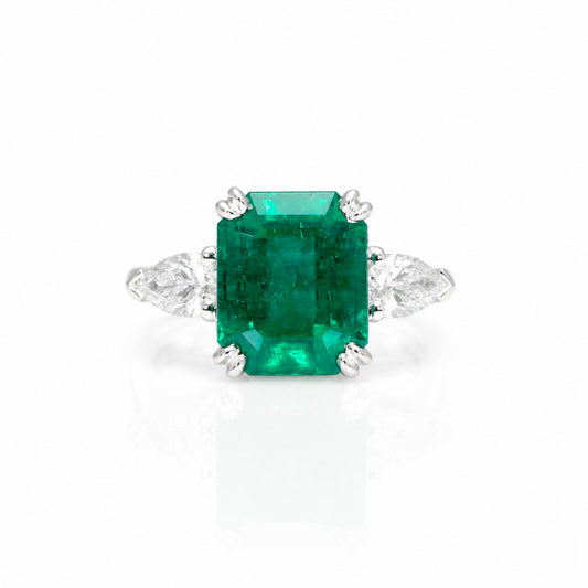 front view of a 6.46 Carats Colombian Emerald and Diamond Statement Ring with GIA Certified diamonds in a white background