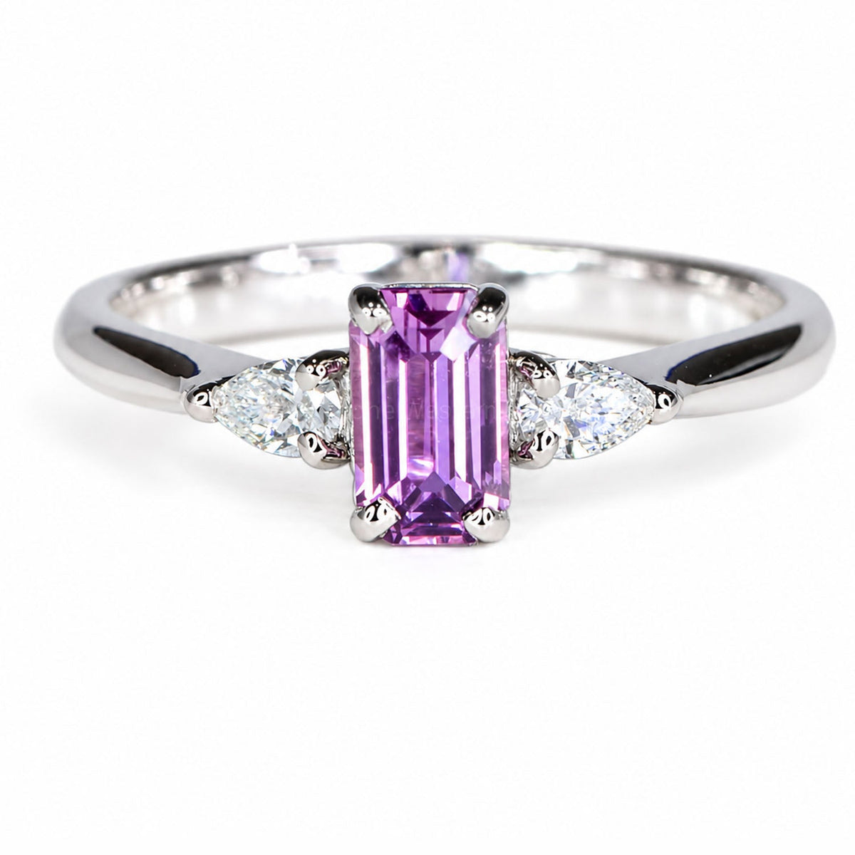 Unheated pink sapphire ring with pear-cut diamond shoulders in white gold