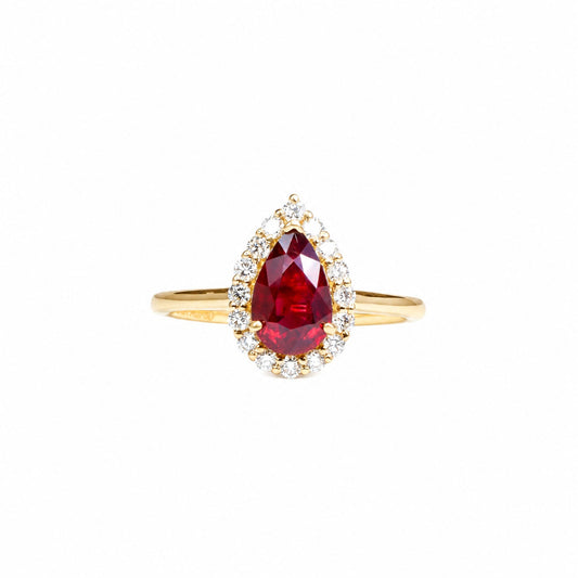 1.61 ct unheated pear-cut ruby with a diamond halo in yellow gold