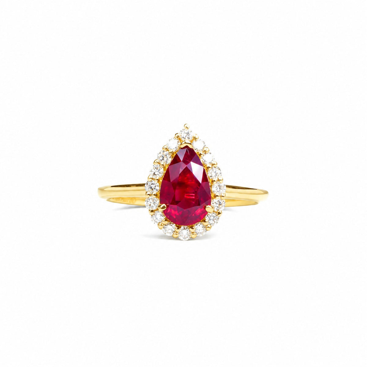 Pear-shaped unheated ruby framed by round diamonds, angled view
