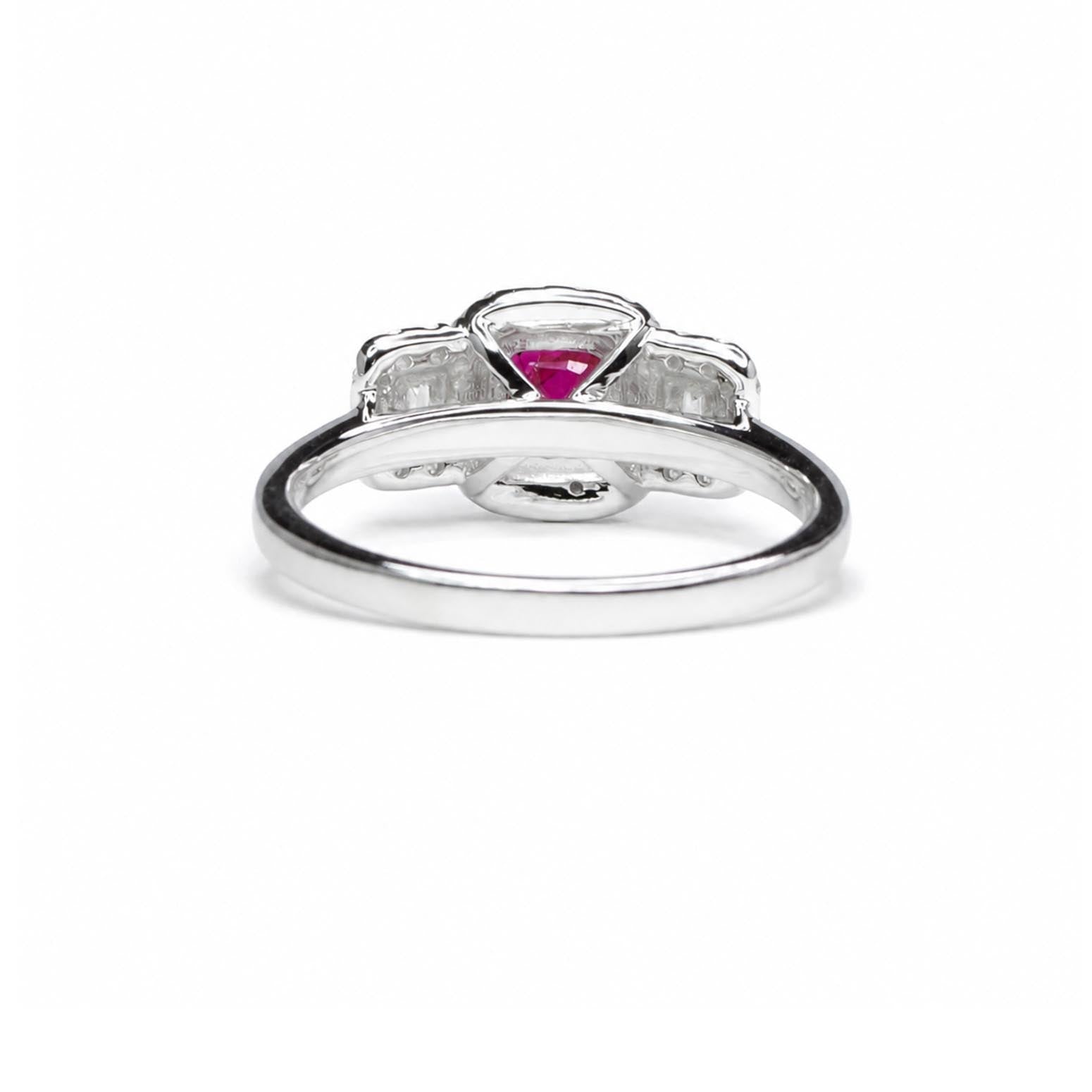 Back view of a 18K white gold ring featuring a central cushion-cut ruby gemstone flanked by two square-cut diamonds, set on a polished band against a white background.
