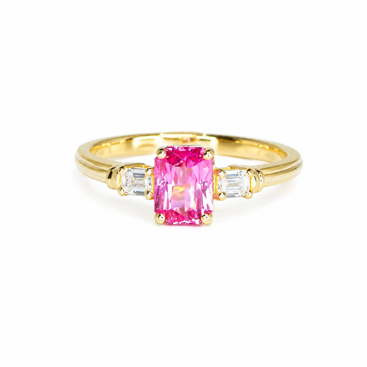 Padparadscha sapphire ring with baguette diamond sides in 18K gold